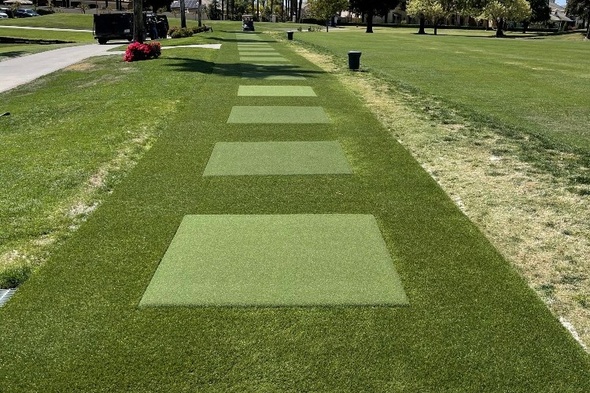 Asheville Outdoor tee line with light green synthetic grass boxes inside a dark green synthetic grass strip